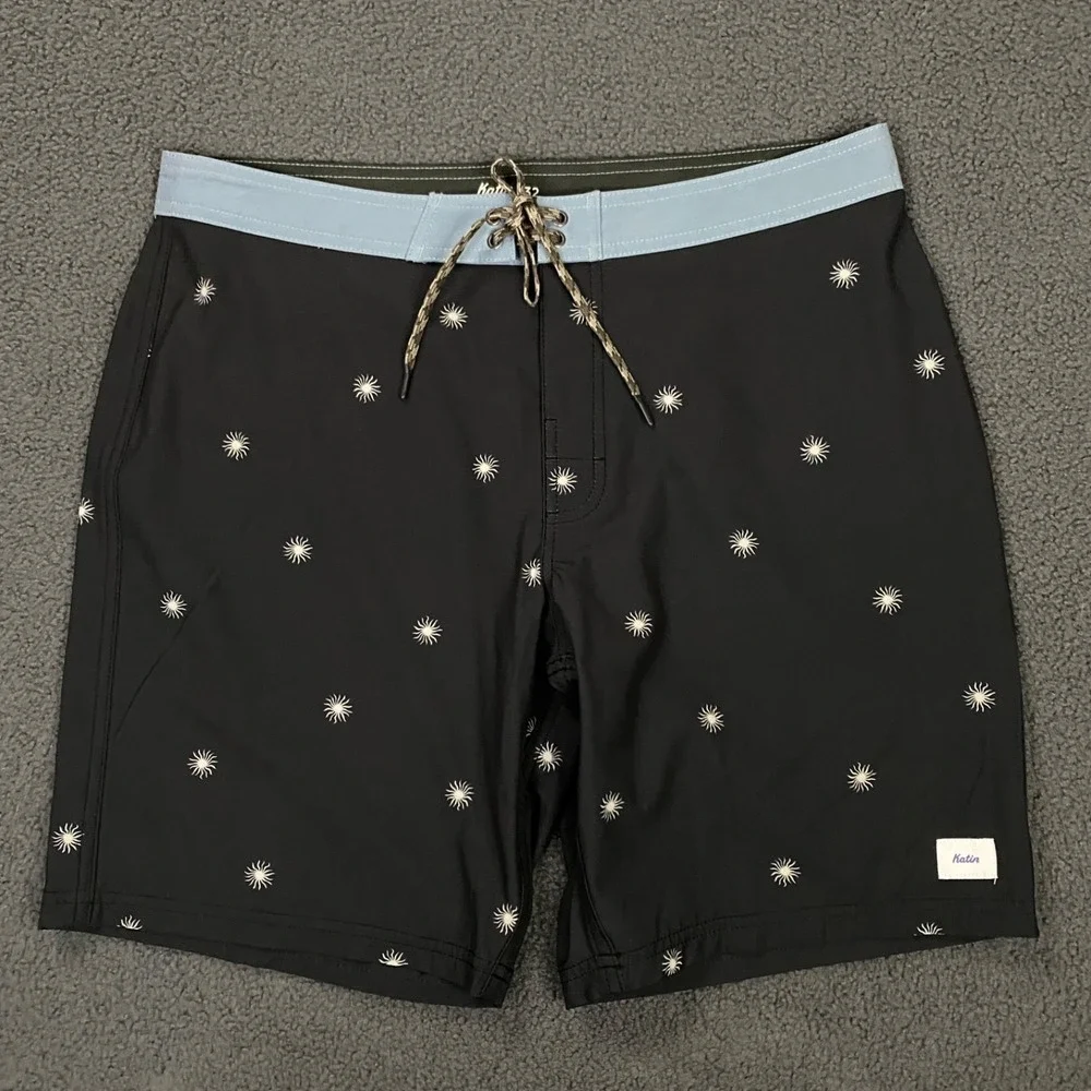 NWOT Katin Black Swim Hybrids with Light Blue Waistband & White Starburst Print